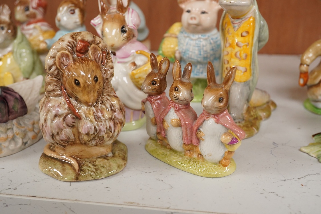 Twenty Beatrix Potter figures, mostly later production figures, largest 11cm high